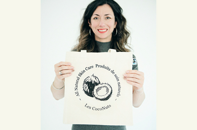 Woman holding Coco Tote Bag